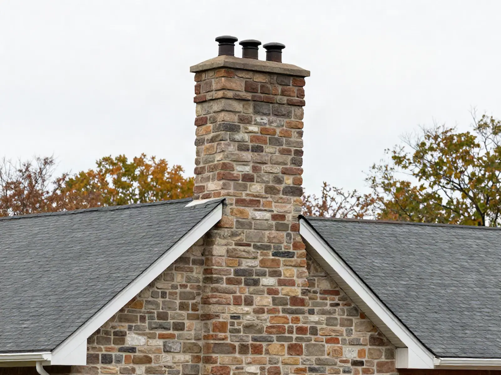 Brick chimney on a home served by Red Cedar Chimney Service in Chicago, IL